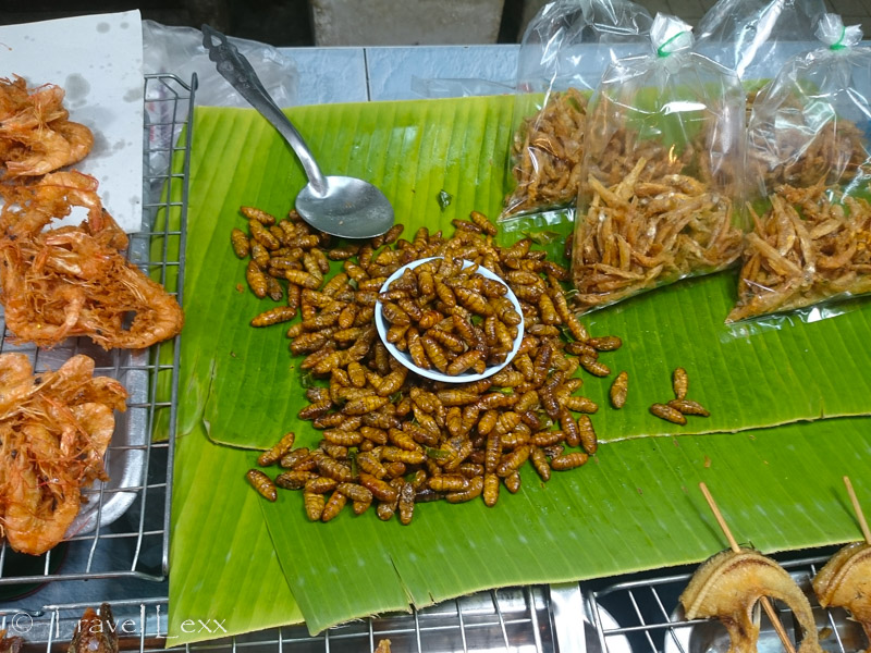 Fried silk worms at a food stand in Chiang Mai, Thailand. They are a popular snack among locals
