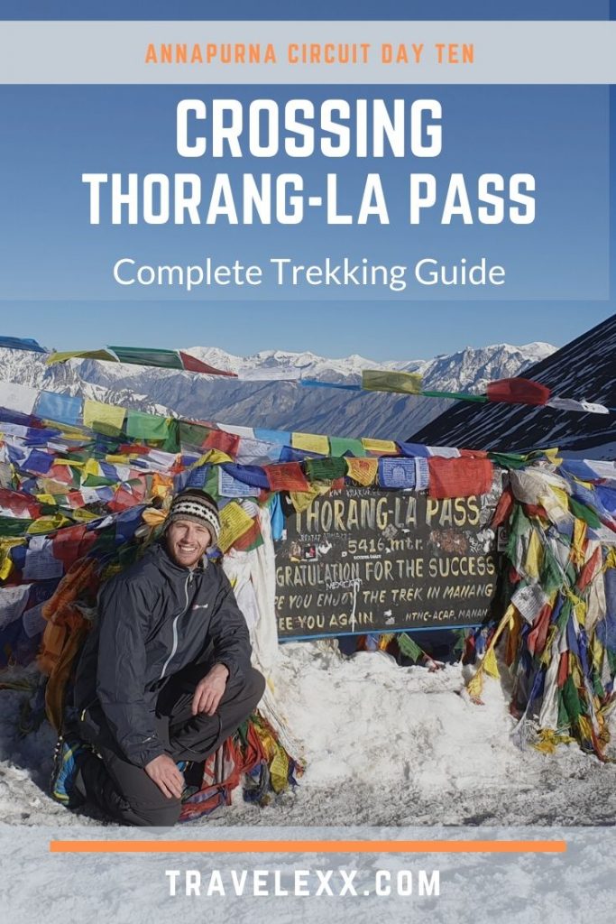 A pinnable image of a man crouching down next to the Thorang-La Pass sign