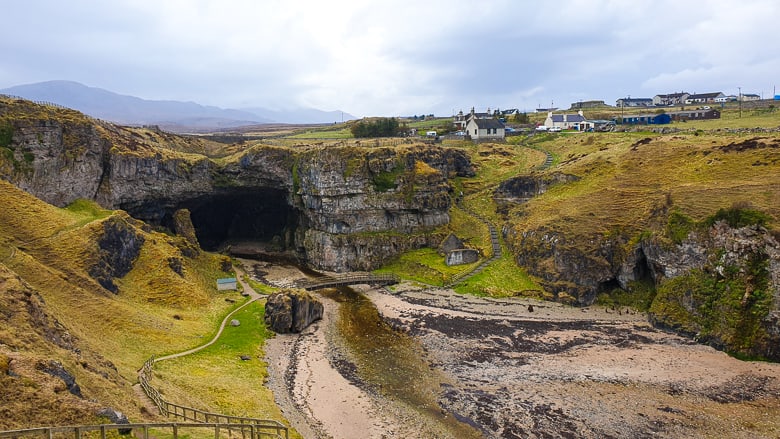An elevated view of the entrance to Smoo Cave along the North Coast 500